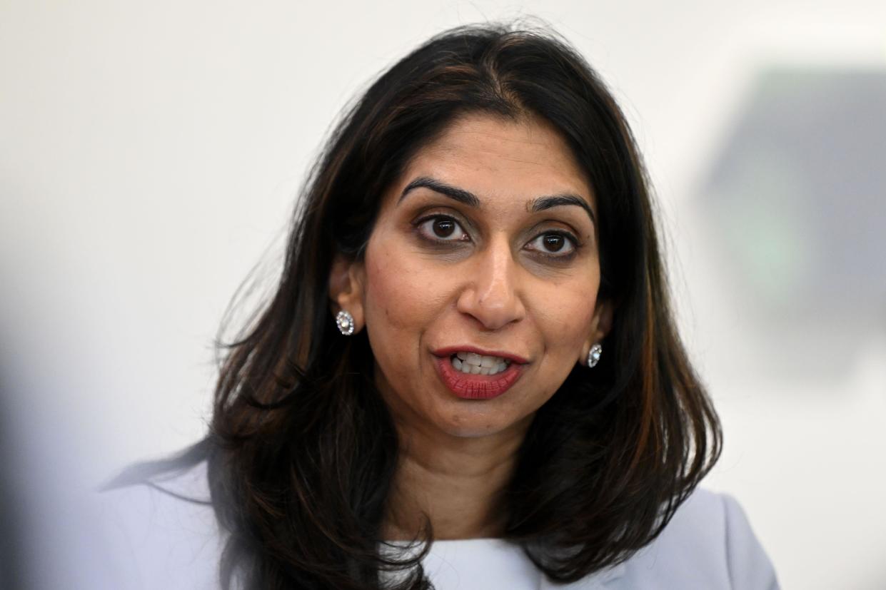 Home Secretary Suella Braverman speaks to volunteers during a visit to Bolton Lads and Girls Club in Bolton, Greater Manchester. Picture date: Tuesday October 3, 2023.