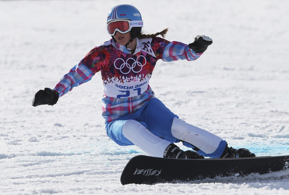 Russia's Alena Zavarzina competes in the small final to take the bronze medal in the women's snowboard parallel giant slalom at the Rosa Khutor Extreme Park, at the 2014 Winter Olympics, Wednesday, Feb. 19, 2014, in Krasnaya Polyana, Russia. (AP Photo/Sergei Grits)