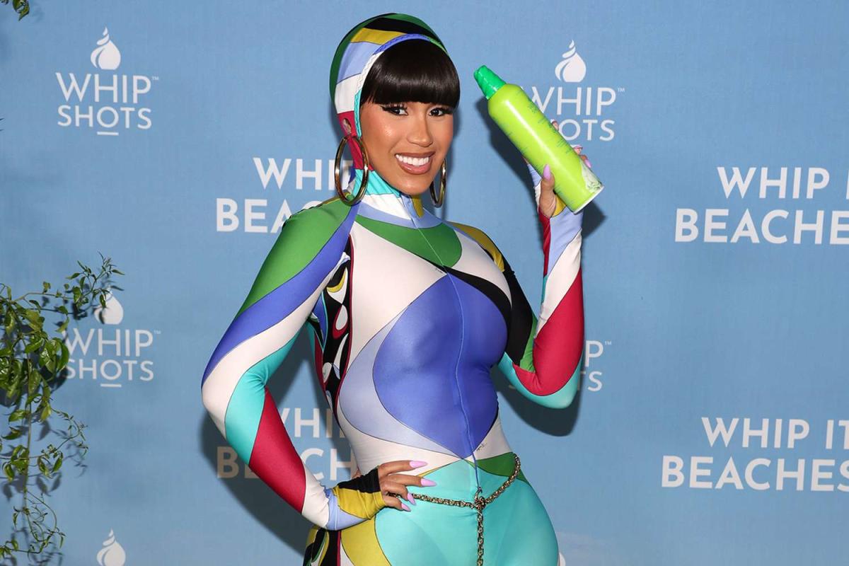 Cardi B Steps Out In Colorful Catsuit For Summer Cocktails Event 