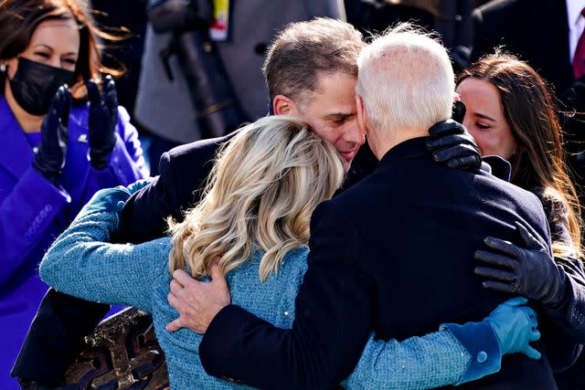 <p>Kevin Dietsch / POOL / AFP via Getty</p> The Biden family hugs on Inauguration Day 2021