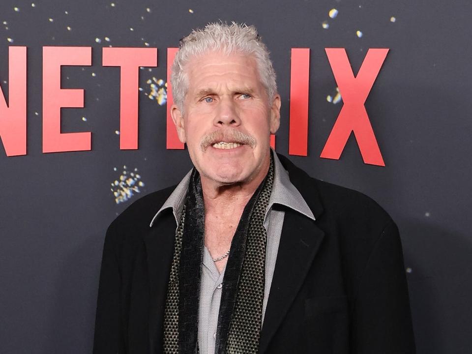 Ron Pearlman in a dark suit