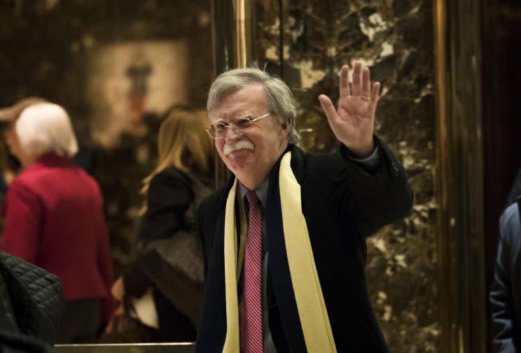 Bolton waves as he leaves Trump Tower in New York City on Dec. 2. (Drew Angerer/Getty Images)