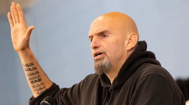 Tattooed dates of death can be seen on John Fetterman's arm as he campaigned for the Senate on Saturday in Pennsylvania. (Photo: via Associated Press)