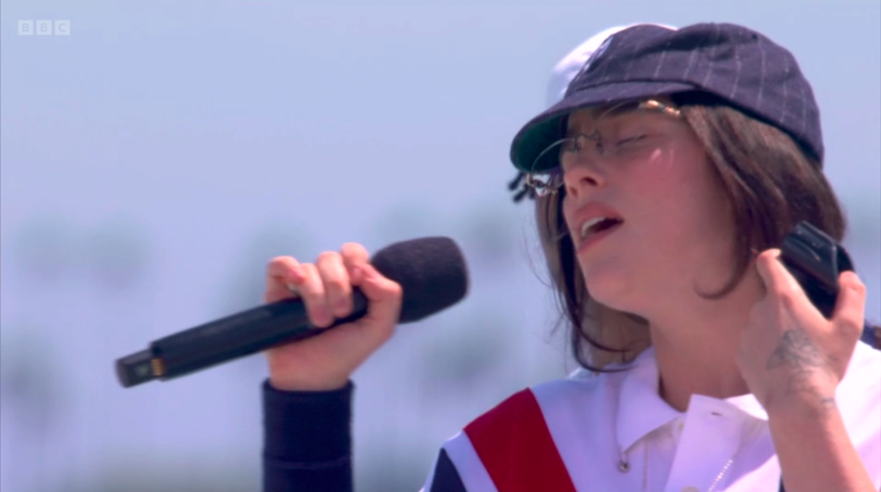 Billie Eilish singing in a pre-recorded gig at Venice Beach. (BBC screenshot)