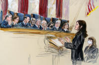 This artist sketch depicts Center for Reproductive Rights Litigation Director Julie Rikelman speaking to the Supreme Court, Wednesday, Dec. 1, 2021, in Washington. Seated to Rikelman's right is Solicitor General Elizabeth Prelogar. Justices seated from left are Associate Justice Brett Kavanaugh, Associate Justice Elena Kagan, Associate Justice Samuel Alito, Associate Justice Clarence Thomas, Chief Justice John Roberts, Associate Justice Stephen Breyer, Associate Justice Sonia Sotomayor, Associate Justice Neil Gorsuch and Associate Justice Amy Coney Barrett. (Dana Verkouteren via AP)