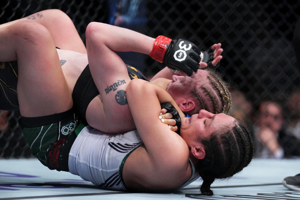 LAS VEGAS, NEVADA - MARCH 04: (R-L) Alexa Grasso of Mexico secures a rear choke submission against Valentina Shevchenko of Kyrgyzstan in the UFC flyweight championship fight during the UFC 285 event at T-Mobile Arena on March 04, 2023 in Las Vegas, Nevada. (Photo by Chris Unger/Zuffa LLC via Getty Images)