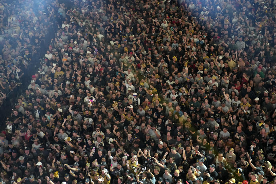 Vegas Golden Knights fans cheer during a rally after a parade along the Las Vegas Strip for the NHL hockey champions Saturday, June 17, 2023, in Las Vegas. (AP Photo/John Locher)