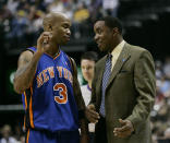 New York Knicks guard Stephon Marbury , left, talks with New York Knicks coach Isiah Thomas during the second quarter of an NBA basketball game against the Indiana Pacers in Indianapolis, Friday,Dec. 15, 2006. (AP Photo/Darron Cummings)