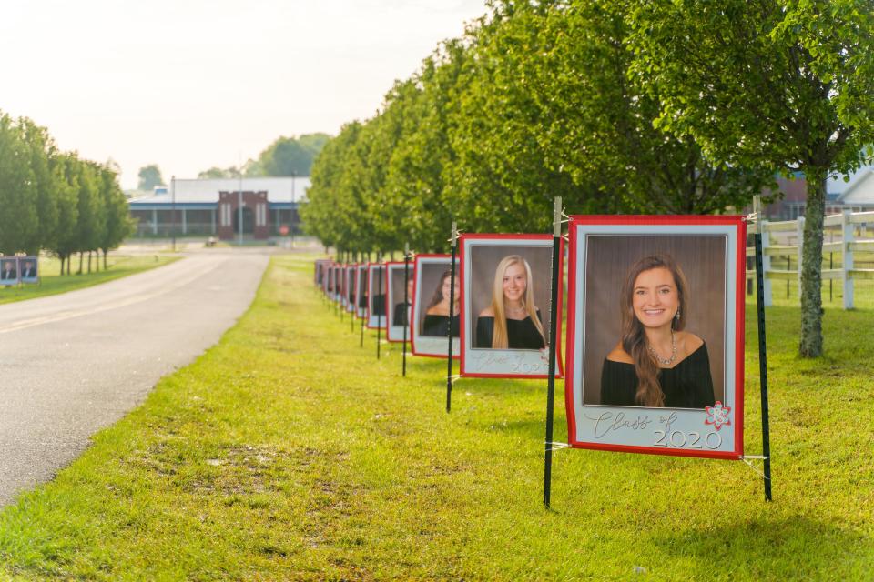 The principal of Poplar Springs High School in Graceville, Florida lined the school driveway with portraits of the graduating senior class. (Photo: Mattox Studios)