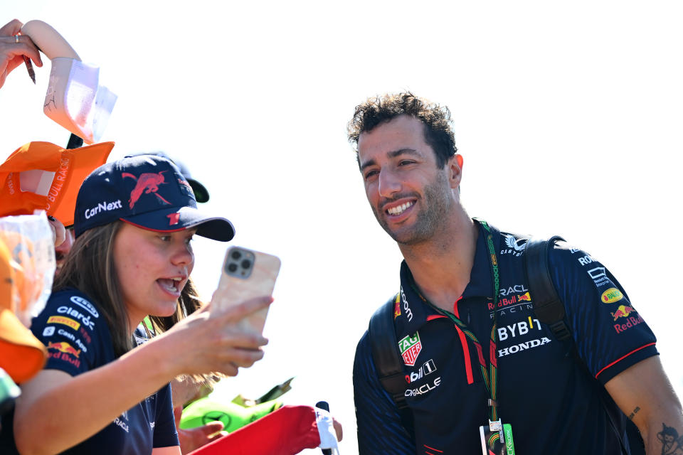 NORTHAMPTON, ENGLAND - JULY 07: Daniel Ricciardo of Australia and Oracle Red Bull Racing greets fans as he arrives at the circuit prior to practice ahead of the F1 Grand Prix of Great Britain at Silverstone Circuit on July 07, 2023 in Northampton, England. (Photo by Dan Mullan/Getty Images)