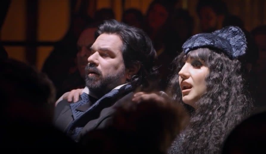 Laszlo and Nadja sitting together at the theatre in "What We Do in the Shadows"