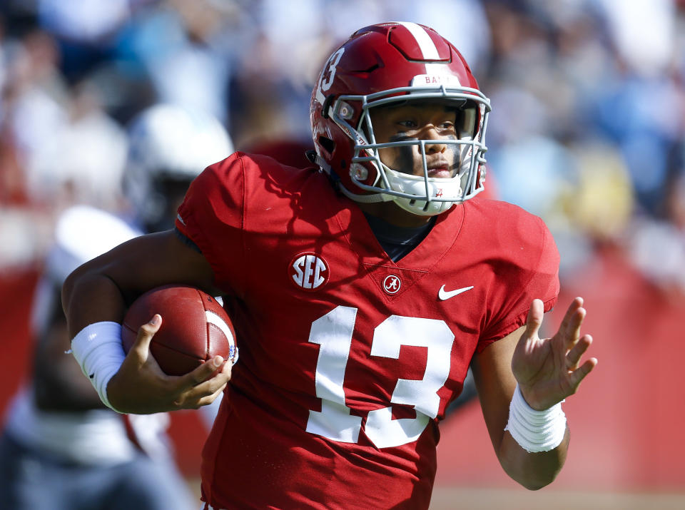 Alabama quarterback Tua Tagovailoa (13) carries the ball during the first half of an NCAA college football game against Citadel, Saturday, Nov. 17, 2018, in Tuscaloosa, Ala. Tagovailoa was named to the 2018 AP All-America NCAA college football second-team, Monday, Dec. 10, 2018. (AP Photo/Butch Dill, File)