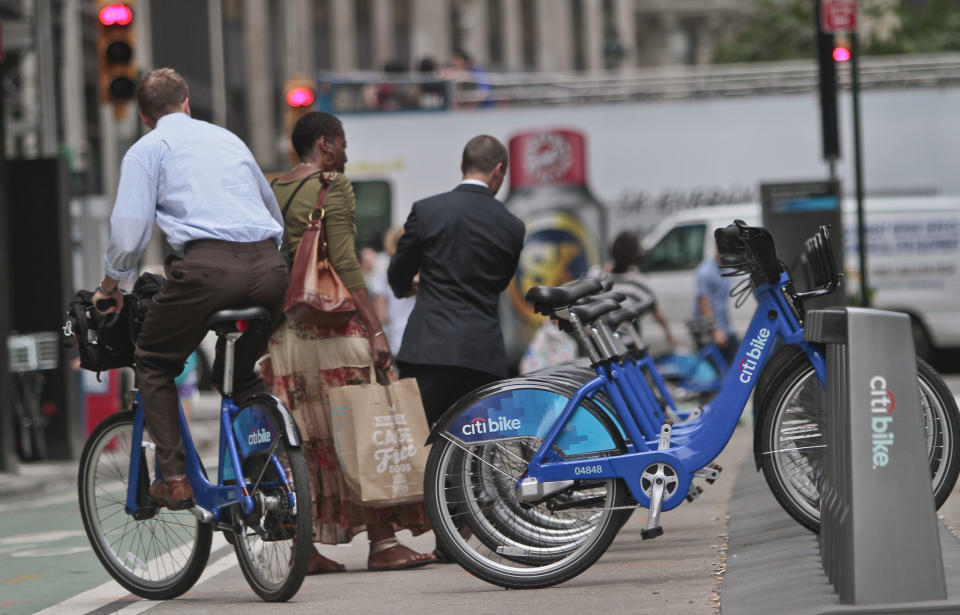 In this Tuesday, June 25, 2013, photo, a biker rides without a helmet on a Citibike, as part of New York City's bike sharing system, in New York. Under Mayor Bloomberg, the city has cracked down on smoking, fatty foods and sugary drinks for health concerns, but the nations largest bike-share program allow riders without helmets. (AP Photo/Bebeto Matthews)