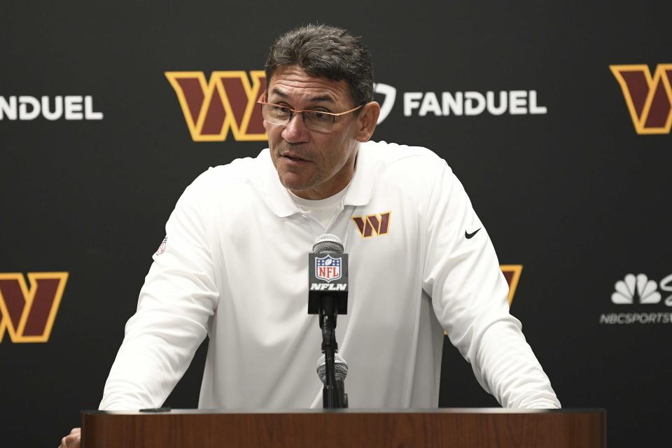 Washington Commanders head coach Ron Rivera quarterback Carson Wentz talks with the media after an NFL football game against the Detroit Lions in Detroit, Sunday, Sept. 18, 2022. (AP Photo/Lon Horwedel)