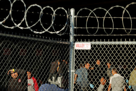 FILE PHOTO: Migrants from Central America are seen inside an enclosure, where they are being held by U.S. Customs and Border Protection (CBP), after crossing the border between Mexico and the United States illegally and turning themselves in to request asylum, in El Paso, Texas, U.S., March 29, 2019. REUTERS/Lucas Jackson