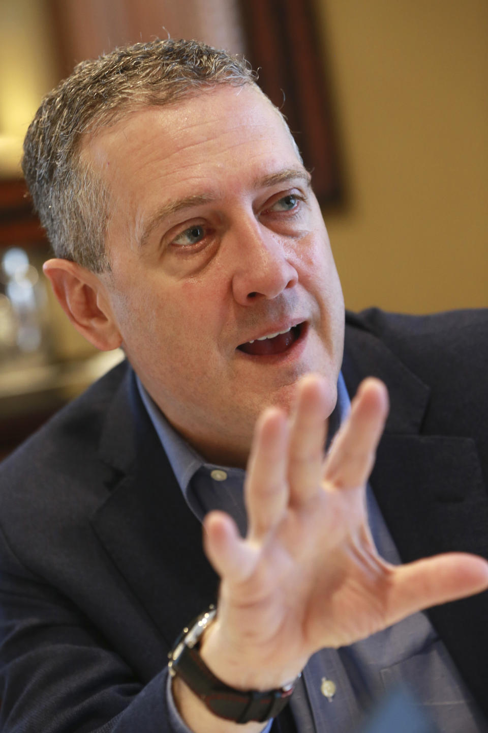 In this Nov. 19, 2019, photo James Bullard, president of the St. Louis Federal Reserve Bank, gestures during an interview in Richmond, Va. (AP Photo/Steve Helber)