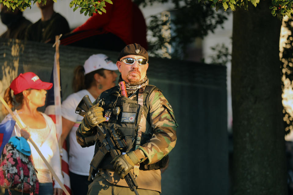 An armed man at a protest in Harrisburg on Saturday. About 2,000 people gathered in the Pennsylvania state capital to show support for President Donald Trump after it was announced that he had lost the 2020 presidential election.   (Photo: Spencer Platt via Getty Images)