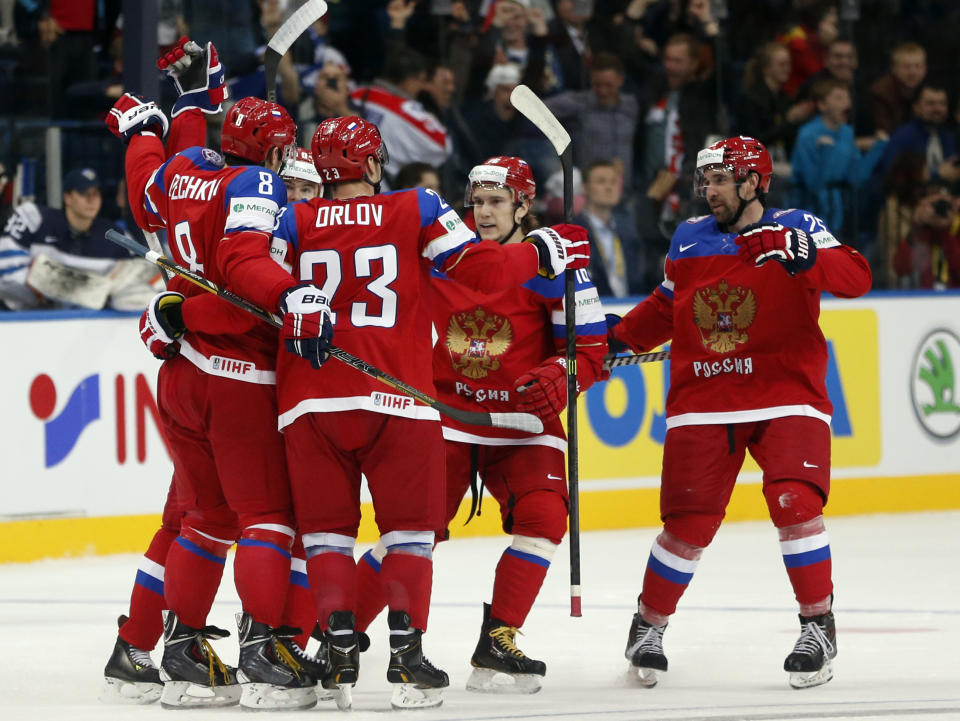Russia players celebrate their goal during the Group B preliminary round match between Russia and Finland at the Ice Hockey World Championship in Minsk, Belarus, Sunday, May 11, 2014. (AP Photo/Darko Bandic)