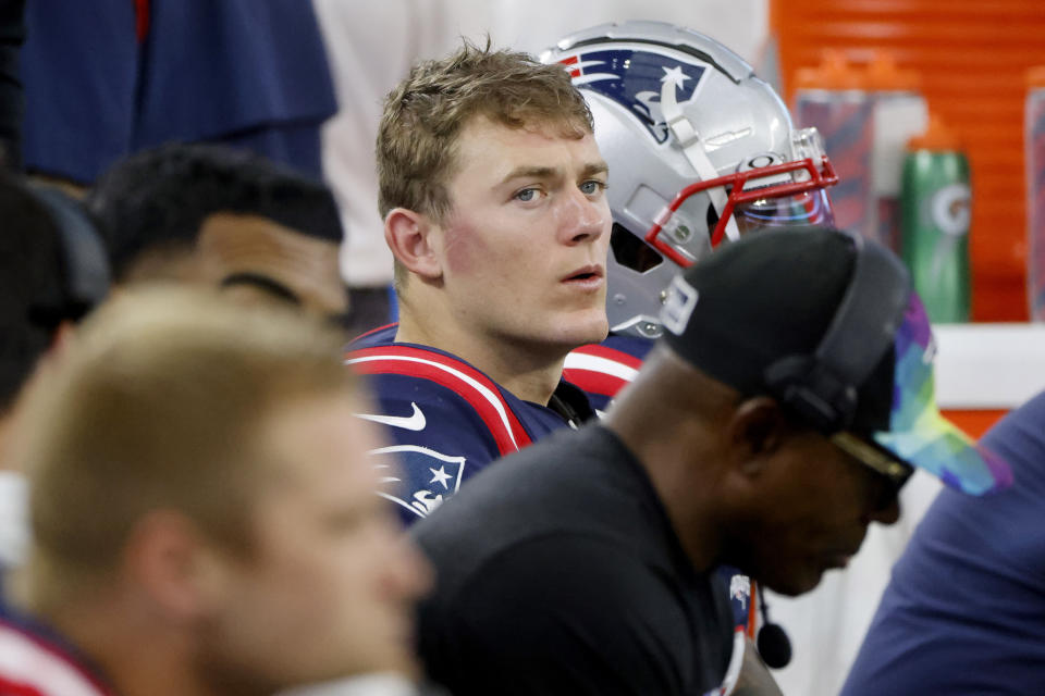 New England Patriots quarterback Mac Jones sits on the bench late in the second half of an NFL football game against the Dallas Cowboys in Arlington, Texas, Sunday, Oct. 1, 2023. (AP Photo/Michael Ainsworth)
