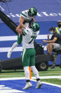 New York Jets wide receiver Braxton Berrios (10) celebrates a touchdown with offensive guard Alex Lewis (71) in the first half of an NFL football game against the Indianapolis Colts in Indianapolis, Sunday, Sept. 27, 2020. (AP Photo/AJ Mast)