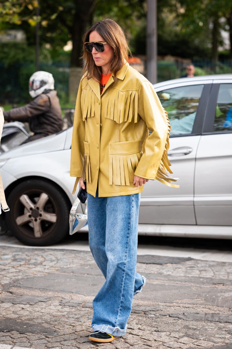 <p> If you’ve been wondering what boho style is, use this tasselled jacket and wide leg denim look as inspiration. The mustard toned jacket has a strong 1970s-inspired influence while the frayed wide leg jeans give a softer, bohemian feel. </p>