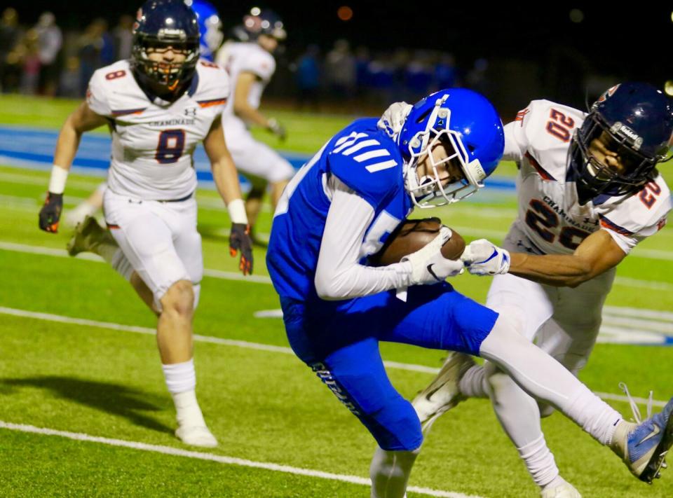 Norco receiver Grant Gray escapes the grasp of Chaminade cornerback Frankie Washington.