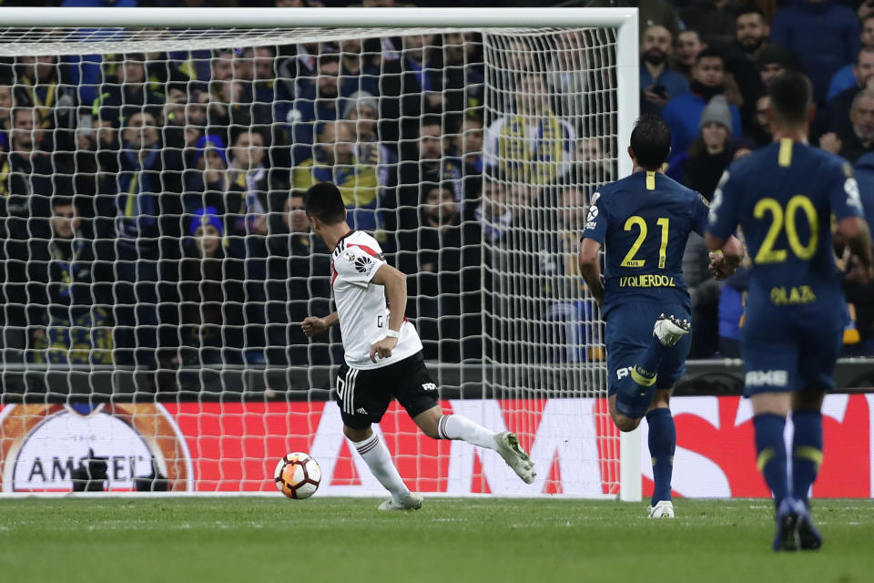 <p>Gonzalo Martinez of River Plate scored his side’s final goal as they came back to win 3-1 after extra-time. The game had been moved after River fans had attacked the Boca team bus (Manu Fernandez/AP) </p>