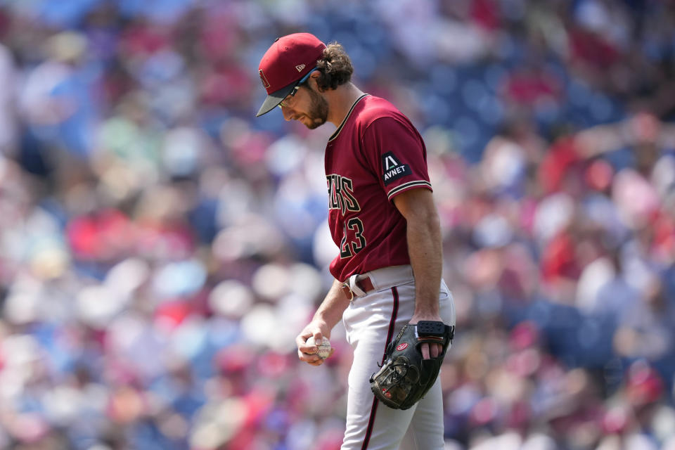 Arizona Diamondbacks' Zac Gallen reacts after giving up a single to Philadelphia Phillies' Kody Clemens during the sixth inning of a baseball game, Wednesday, May 24, 2023, in Philadelphia. (AP Photo/Matt Slocum)