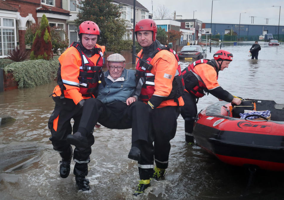 Fire and Rescue service members rescue residents trapped by floodwater in Doncaster, Yorkshire, as parts of England endured a month's worth of rain in 24 hours, with scores of people rescued or forced to evacuate their homes, others stranded overnight in a shopping centre, and travel plans thrown into chaos. PA Photo. Picture date: Friday November 8, 2019. See PA story WEATHER Rain. Photo credit should read: Danny Lawson/PA Wire