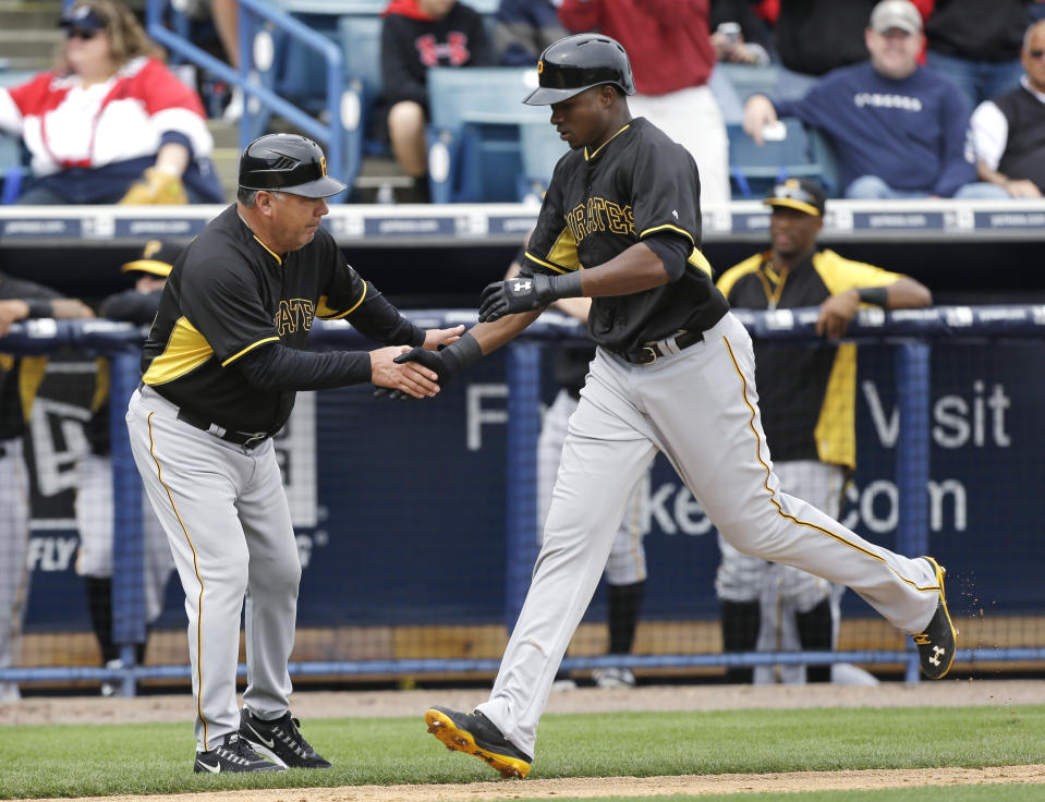 Pittsburgh Pirates right fielder Gregory Polanco is greeted by third base coach Nick Leyva, left, after hitting a home run during the first inning of an exhibition baseball game against the New York Yankees Thursday, Feb. 27, 2014, in Tampa, Fla. (AP Photo/Charlie Neibergall)