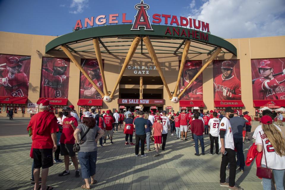 Fans line up to enter Angel Stadium.