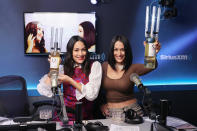 <p>Brie and Nikki Bella raise a glass (er, bottle) as they host SiriusXM Stitcher's The Bellas Podcast in N.Y.C. on Nov. 18. </p>