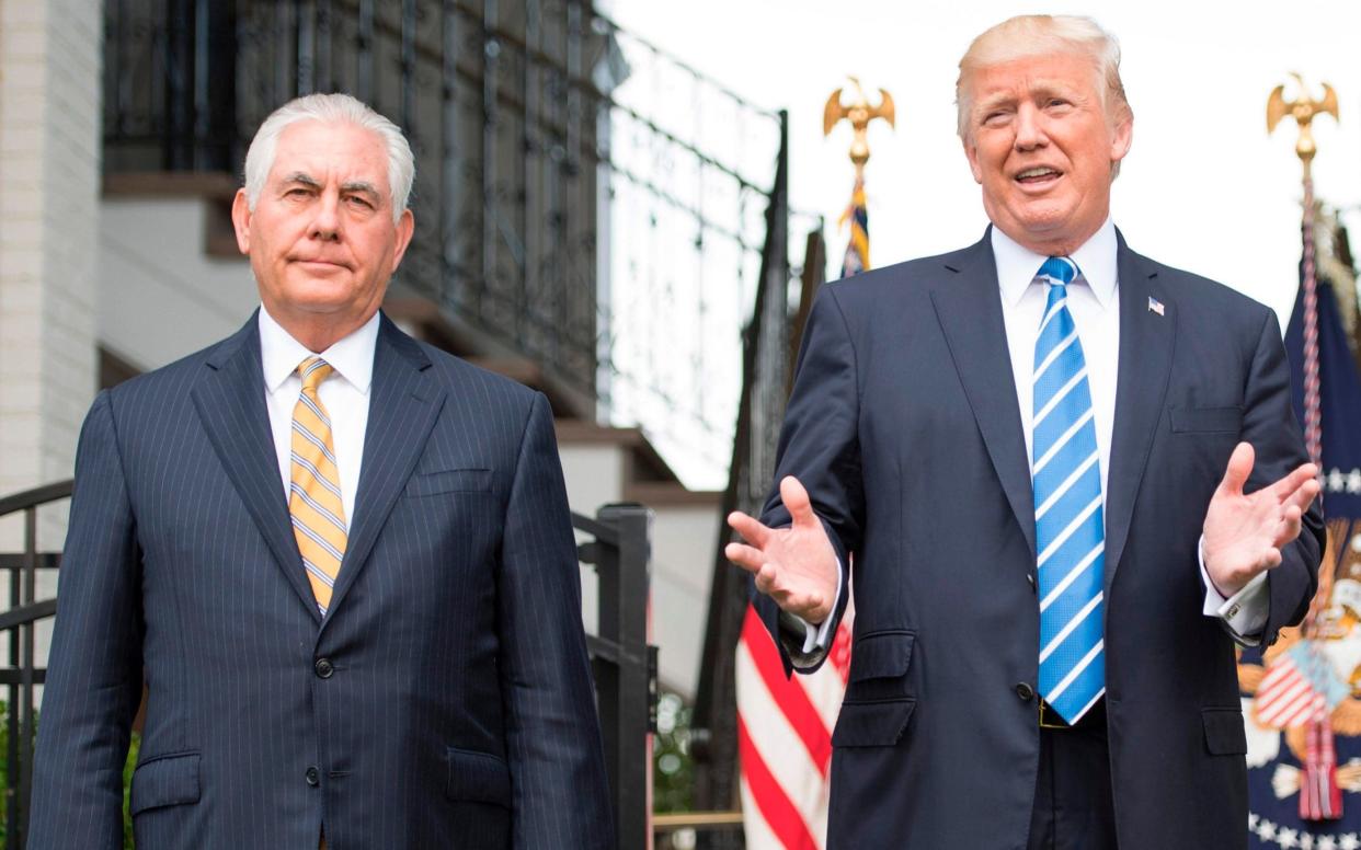 US President Donald Trump (R) speaks to the press with US Secretary of State Rex Tillerson (L) on August 11, 2017, at Trump National Golf Club in Bedminster, New Jersey - AFP