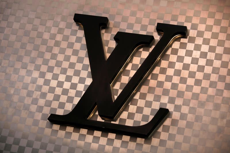 FILE PHOTO: A Louis Vuitton logo is seen outside the store at Hong Kong's Tsim Sha Tsui shopping district