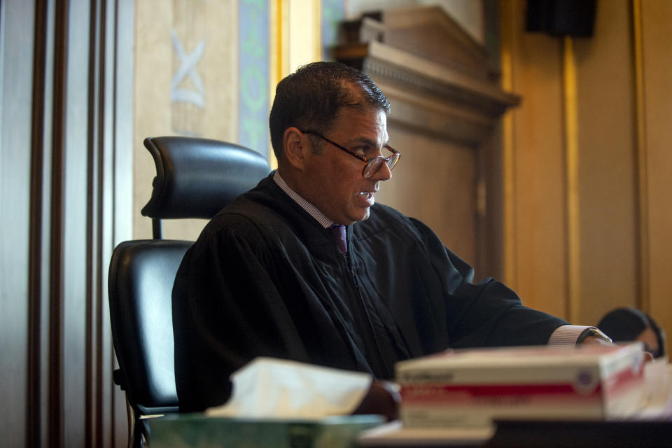 Genesee County Circuit Judge Mark Latchana asks questions to both attorneys Monday, July 26, 2021 at Genesse County Circuit Court in downtown Flint, Mich in response to a lawsuit that claims Shiawassee commissioners violated the state Open Meetings Act by deliberating about the COVID-19 hazard payments behind closed doors. (Jake May/The Flint Journal via AP)