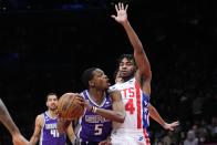 Brooklyn Nets' Cam Thomas (24) defends against Sacramento Kings' De'Aaron Fox (5) during the first half of an NBA basketball game Thursday, March 16, 2023, in New York. (AP Photo/Frank Franklin II)