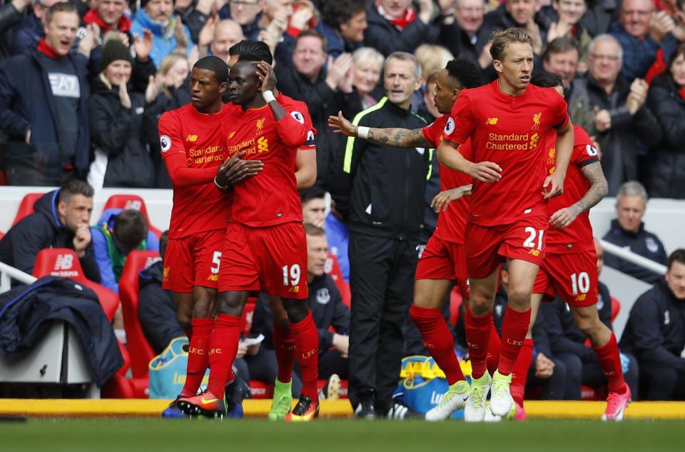 <p>Liverpool’s Sadio Mane celebrates scoring their first goal with team mates </p>