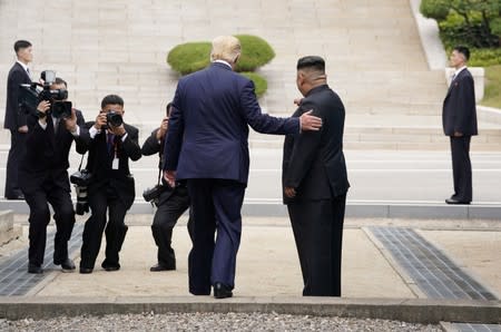 U.S. President Trump and North Korean leader Kim Jong Un meet at the Korean Demilitarized Zone