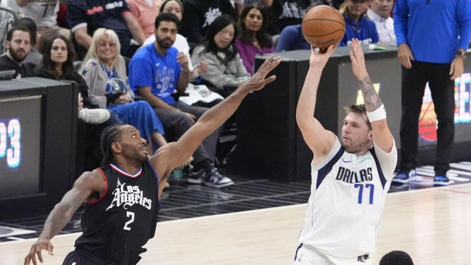 Kawhi Leonard (left)  Dallas guard Luka Doncic