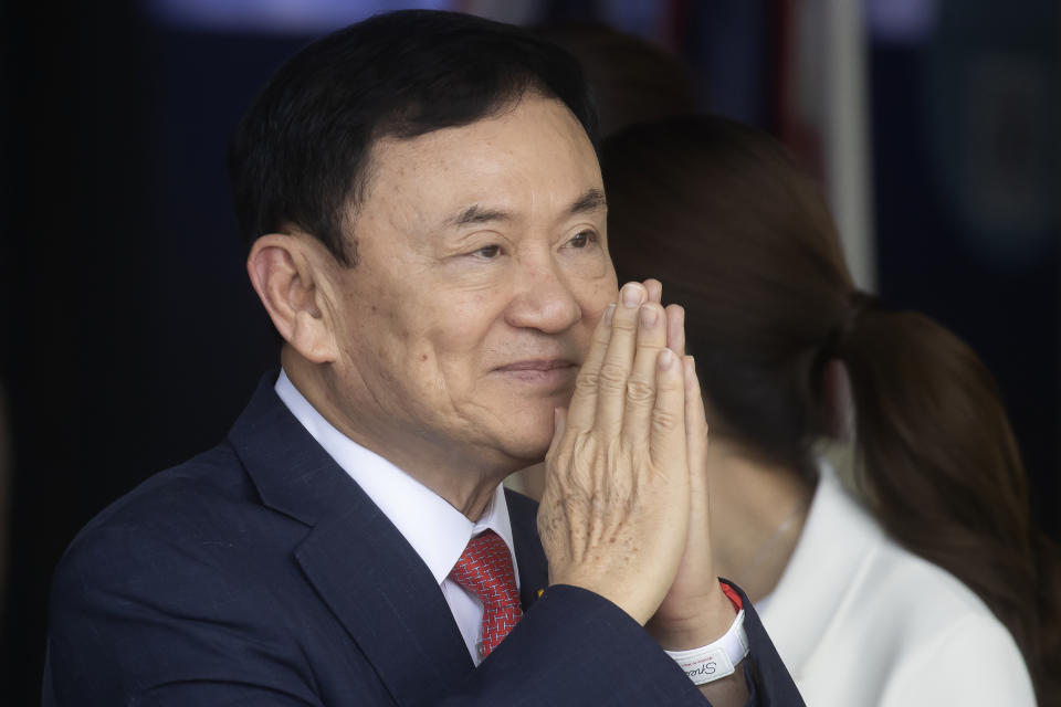 Thailand's former Prime Minister Thaksin Shinawatra greets supporters on his arrival at Don Muang airport in Bangkok, Thailand, Tuesday, Aug. 22, 2023. (AP Photo/Wason Wanichakorn)
