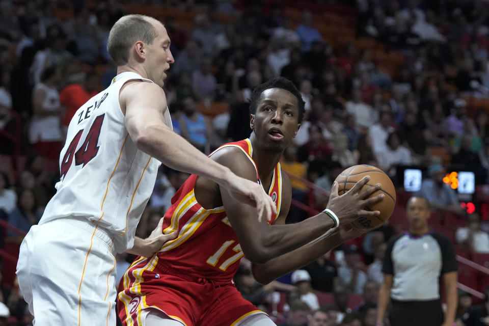 Atlanta Hawks forward Onyeka Okongwu (17) looks for an opening past Miami Heat center Cody Zeller (44) during the first half of an NBA basketball game, Monday, March 6, 2023, in Miami. (AP Photo/Wilfredo Lee)