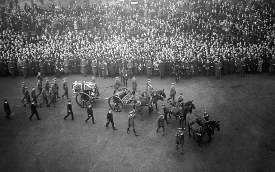 The coffin of the unknown warrior carried in procession through London in 1920 - Getty Images