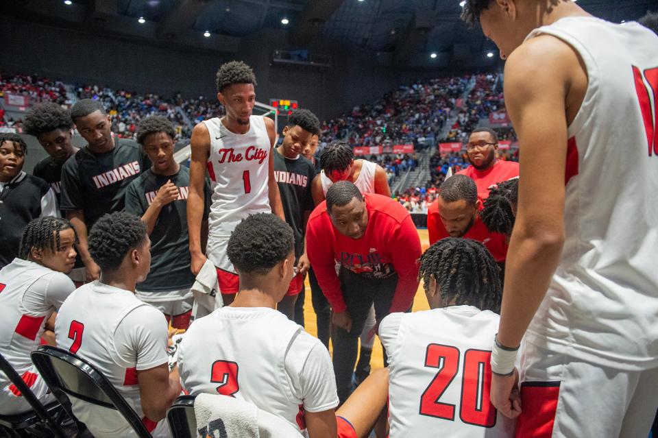Yahoo City's coach Anthony Carlyle talks strategy with the Indians during the MHSAA Class 5A basketball tournament championship against Canton in Jackson, Miss., Saturday, March 1, 2024.