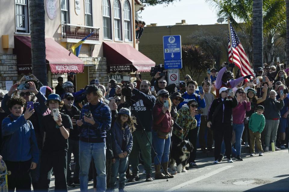 People watch as Biden arrives in Capitola