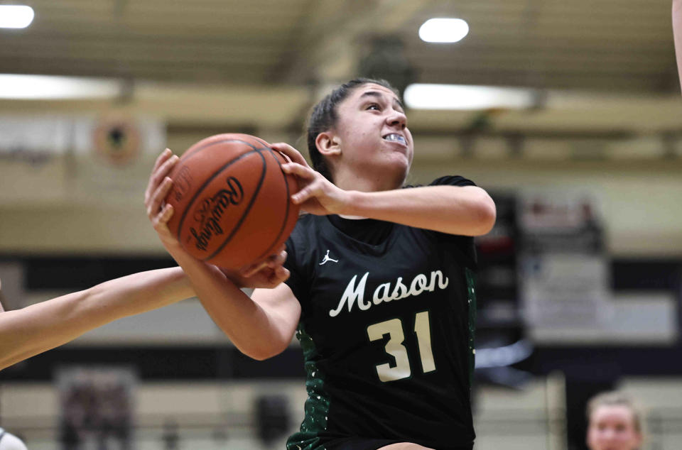 Mason guard Anna Habra (31) drives to the basket during their basketball game against Lakota East Wednesday, Jan. 3, 2024. Mason won 55-47.