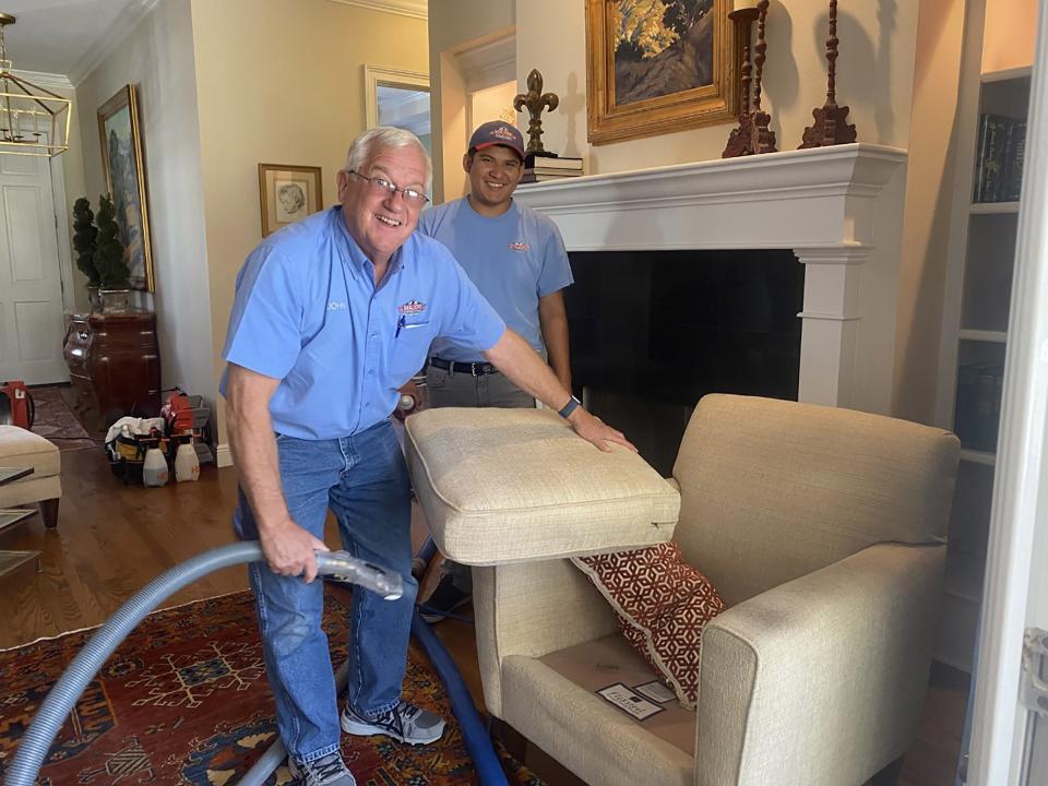 Half the success of removing stains from upholstered furniture lies in knowing the right chemicals to use, says John Gartner, pictured here cleaning a chair the owner’s dog loves too much.