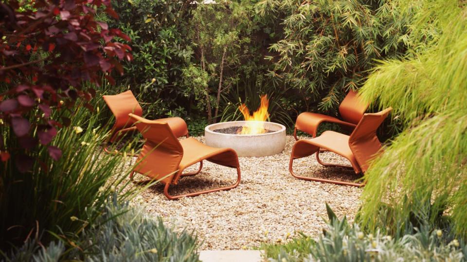 outdoor fireplace and chairs