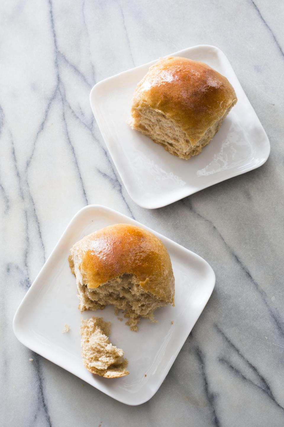 This undated photo provided by America's Test Kitchen in November 2018 shows honey-wheat dinner rolls in Brookline, Mass. This recipe appears in the cookbook "Bread Illustrated." (Carl Tremblay/America's Test Kitchen via AP)