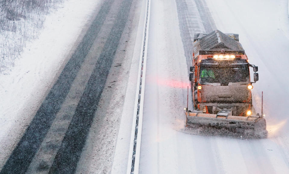 A snowplough keeps the A66 open at Bowes, Durham.