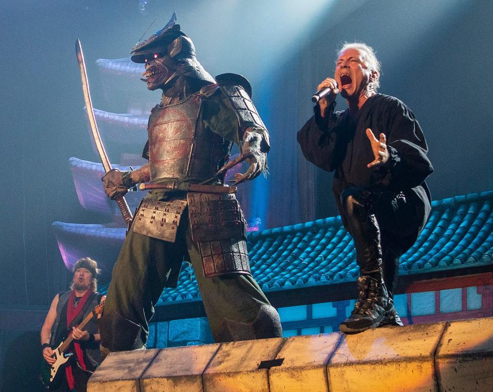 WORCESTER - Iron Maiden lead singer Bruce Dickinson performs next to the band's long-time mascot Eddie, dressed as a samurai on this tour, at the DCU Center Monday, October 17, 2022. 